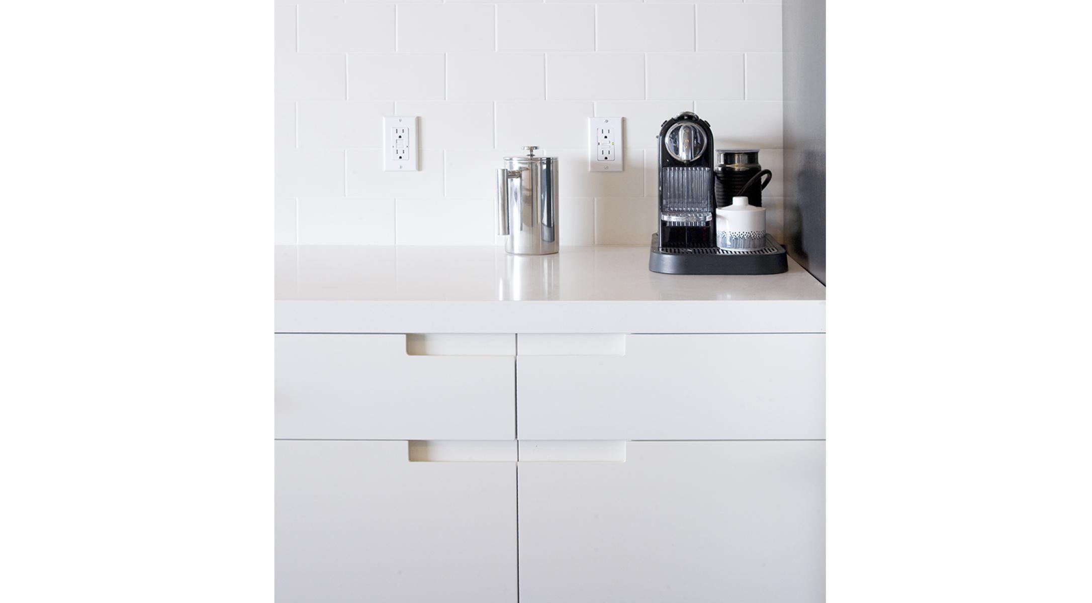 Dunsmuir Cabinets custom Ikea painted white integrated pulls